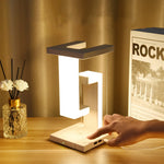 Load image into Gallery viewer, Elegante Tischlampe "anti-gravity" mit Ladestation
